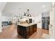 Open-concept kitchen features a large island, stainless steel appliances, and a seamless transition to the living area at 4410 Mildred Bass Rd, St Cloud, FL 34772