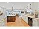 Open-concept kitchen features ample counter space, stainless steel appliances, and seamless flow to the dining area at 4410 Mildred Bass Rd, St Cloud, FL 34772