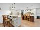 Bright kitchen with white cabinetry, granite countertops, pendant lighting, and a breakfast bar with seating at 4410 Mildred Bass Rd, St Cloud, FL 34772