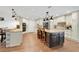 Spacious kitchen boasting a center island, granite countertops, and ample cabinet space with modern stainless appliances at 4410 Mildred Bass Rd, St Cloud, FL 34772