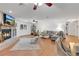 Bright living room with hardwood floors, brick fireplace, and comfortable seating at 4410 Mildred Bass Rd, St Cloud, FL 34772