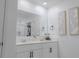 Bright bathroom with double vanity sinks, large mirror, and contemporary design at 466 Cool Summer Ln, Davenport, FL 33837