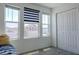 Bedroom with lots of natural light, three windows, and a large closet at 466 Cool Summer Ln, Davenport, FL 33837