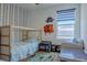 This charming bedroom features a unique accent wall and a cozy bunk bed at 466 Cool Summer Ln, Davenport, FL 33837