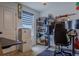 Gaming room with a desk, monitor, chair, and shelves with collectables at 466 Cool Summer Ln, Davenport, FL 33837