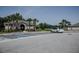 Community clubhouse with designated handicap parking and lush landscaping at 466 Cool Summer Ln, Davenport, FL 33837