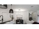 Modern dining area featuring stylish lighting, contemporary decor, and seamless flow to the living space at 466 Cool Summer Ln, Davenport, FL 33837