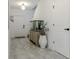 Inviting entryway featuring tile flooring, an aquarium, and crisp, white trim at 466 Cool Summer Ln, Davenport, FL 33837