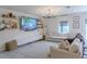 Inviting living room featuring a large sectional sofa, contemporary decor, and ample natural light at 466 Cool Summer Ln, Davenport, FL 33837