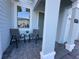 Inviting front porch with cozy seating, perfect for enjoying a relaxing afternoon at 4736 Tribute Trl, Kissimmee, FL 34746
