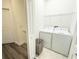 This laundry room includes a washing machine, dryer, wire rack and a basket for storage at 4736 Tribute Trl, Kissimmee, FL 34746