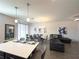 Bright living area with quartz countertops and modern finishes, perfect for entertaining at 4736 Tribute Trl, Kissimmee, FL 34746