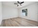 Well-lit bedroom with modern ceiling fan, showcasing a serene space for relaxation and rest, complemented by natural light at 5254 Mill Stream Dr, St Cloud, FL 34771