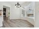 Bright dining room with hardwood floors and large windows providing ample natural light at 5254 Mill Stream Dr, St Cloud, FL 34771