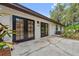 Side view of home with french doors leading to patio and backyard at 5254 Mill Stream Dr, St Cloud, FL 34771