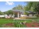Attractive one story home with a landscaped yard, healthy lawn, mature trees and decorative urn in the front yard at 5254 Mill Stream Dr, St Cloud, FL 34771