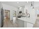 Modern kitchen featuring white quartz countertops, gray cabinets, and stainless steel appliances at 5254 Mill Stream Dr, St Cloud, FL 34771