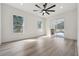 Bright living room with hardwood floors and sliding glass door to backyard at 5254 Mill Stream Dr, St Cloud, FL 34771