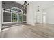 Open-concept living space with luxury vinyl plank flooring, modern lighting, and natural light at 5254 Mill Stream Dr, St Cloud, FL 34771