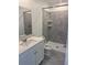 Clean bathroom featuring a shower, a tiled shower, and modern fixtures and hardware in neutral color palette at 553 Sea Turtle Ln, Haines City, FL 33844