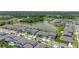 Aerial view of the community with a lake and green surroundings. A FedEx truck is parked on the street at 5648 Cedar Chase Dr, St Cloud, FL 34771