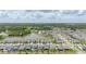 Aerial view of a well-planned community with beautiful homes, a pond, and green surroundings at 5648 Cedar Chase Dr, St Cloud, FL 34771
