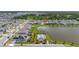 Aerial view of a home in a lakeside community, near the pool and clubhouse with many amenities at 5648 Cedar Chase Dr, St Cloud, FL 34771