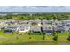Backyards of the homes featuring outdoor seating and screened in pools located near lake and green surrounding area at 5648 Cedar Chase Dr, St Cloud, FL 34771