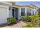Inviting home entrance with lovely landscaping and brick walkway at 5648 Cedar Chase Dr, St Cloud, FL 34771