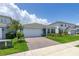 Attractive home with a brick driveway, green lawn, and mature landscaping at 5648 Cedar Chase Dr, St Cloud, FL 34771