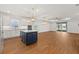 Open concept kitchen with island, stainless appliances and a view to the living area at 5648 Cedar Chase Dr, St Cloud, FL 34771