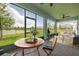 Relaxing screened porch with a dining area and an outdoor living space at 5648 Cedar Chase Dr, St Cloud, FL 34771