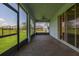 Spacious screened patio with brick flooring, ceiling fan, and sliding door to the main home at 5648 Cedar Chase Dr, St Cloud, FL 34771
