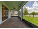 Screened-in porch with brick flooring and an open view of the backyard and lake at 5648 Cedar Chase Dr, St Cloud, FL 34771