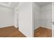 Walk-in closet adjacent to bedroom featuring wood-look tile flooring and wire shelving at 5648 Cedar Chase Dr, St Cloud, FL 34771
