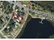 Aerial view of property with lake view, and surrounding neighborhood, outlined in red at 612 Lakeshore Blvd, Kissimmee, FL 34744