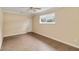 Bedroom featuring tile flooring, ceiling fan, and natural light from a window at 612 Lakeshore Blvd, Kissimmee, FL 34744