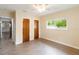 The bedroom offers tile floors, a ceiling fan, and two wood closets at 612 Lakeshore Blvd, Kissimmee, FL 34744