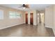 Spacious bedroom features tile floors, a ceiling fan, and great closet space at 612 Lakeshore Blvd, Kissimmee, FL 34744