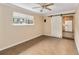 Bedroom featuring tile flooring, ceiling fan, sliding barn door to the kitchen and natural light at 612 Lakeshore Blvd, Kissimmee, FL 34744