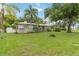 Beautiful single-story home with lush landscaping, privacy fence and a well-manicured lawn at 612 Lakeshore Blvd, Kissimmee, FL 34744
