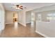 Open-concept living room featuring tile flooring and access to the kitchen at 612 Lakeshore Blvd, Kissimmee, FL 34744