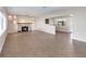 Spacious living room featuring a stone fireplace, decorative lighting, and neutral tile flooring at 612 Lakeshore Blvd, Kissimmee, FL 34744