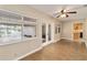 Cozy living room with tile floors, ceiling fan, and sliding glass doors to the lanai at 612 Lakeshore Blvd, Kissimmee, FL 34744