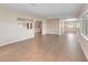 Expansive living room with neutral tile floors, and an open floor plan perfect for entertaining at 612 Lakeshore Blvd, Kissimmee, FL 34744