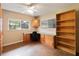 Inviting office space with a built-in desk, shelving, and bright windows at 612 Lakeshore Blvd, Kissimmee, FL 34744