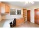 This office includes built-in shelves, drawers, desk, and tile floors at 612 Lakeshore Blvd, Kissimmee, FL 34744