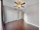 Bedroom featuring hardwood floors, closet space, and a ceiling fan at 626 Orange Dr # 243, Altamonte Springs, FL 32701