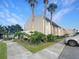 Inviting multi-story condo building surrounded by lush tropical landscaping and palm trees at 626 Orange Dr # 243, Altamonte Springs, FL 32701