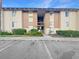 Exterior shot of building with covered stairwells and assigned parking at 626 Orange Dr # 243, Altamonte Springs, FL 32701